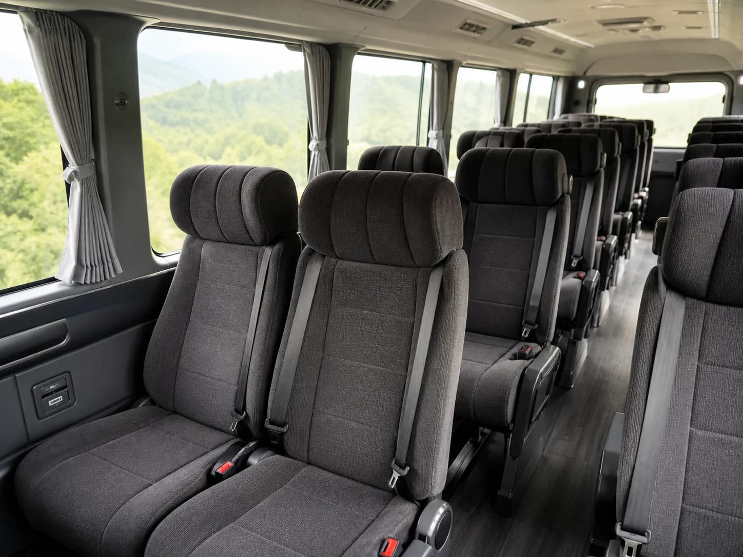 Comfortable reclining seats inside a modern passenger minibus